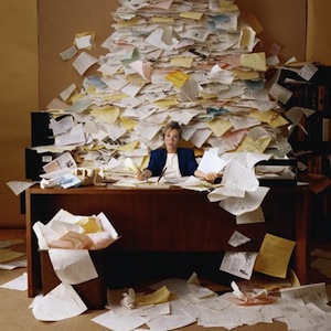 desk-with-pile-of-papers